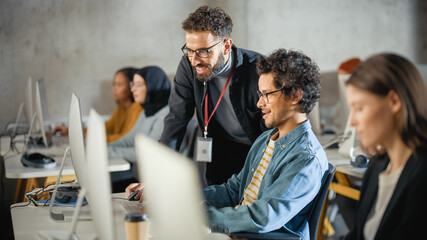 Fototapete - Lecturer Helps Scholar with Project, Advising on Their Work. Teacher Giving Lesson to Diverse Multiethnic Group of Female and Male Students in College Room, Teaching New Academic Skills on a Computer.