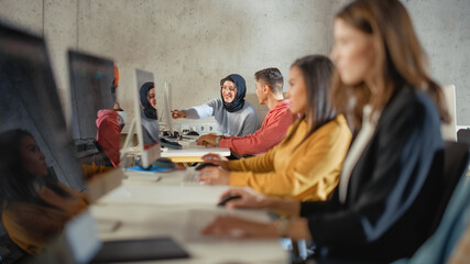 Leinwandbilder - Smart Young Students Studying in University with Diverse Multiethnic Classmates. Scholars Collaborate in College Room with Computers. Applying Knowledge to Acquire Academic Skills in Class.