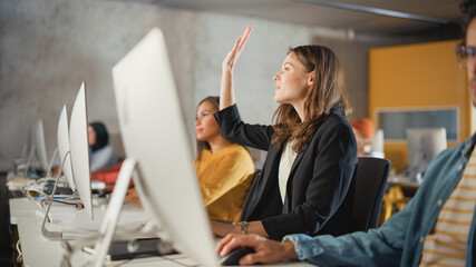 Fototapete - Beautiful Smart Female Student, Studying in University with Diverse Multiethnic Classmates. She Raises Hand and Asks Teacher a Question. Applying Her Knowledge to Acquire Academic Skills in Class.