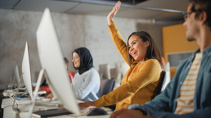 Fototapete - Beautiful African American Female Student, Studying in University with Diverse Classmates. She Raises Hand and Asks Teacher a Question. Applying Her Knowledge to Acquire Academic Skills in Class.