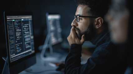Fototapete - Handsome Smart Male Student, Studying in University with Diverse Multiethnic Classmates. He Works on Desktop Computer in College. Applying His Knowledge in Writing Code, Developing Software.