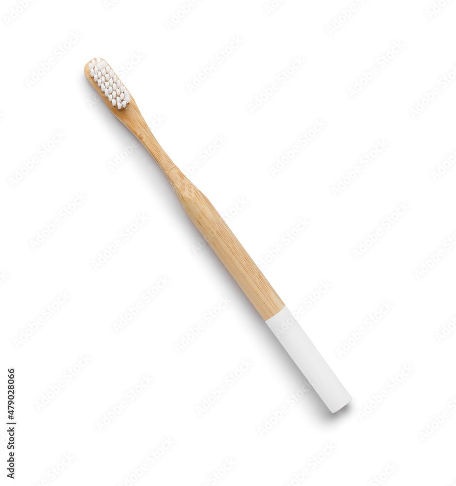 Bamboo toothbrush on white background