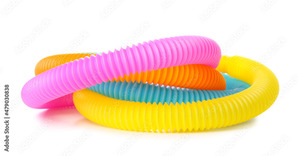 Different colorful Pop Tubes on white background