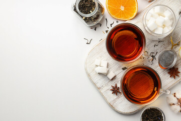 Concept of hot drink with tea on white background