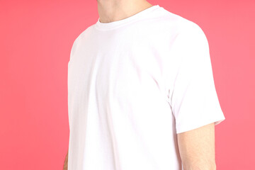 Canvas Print - Man in blank white t-shirt on pink background