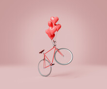 Flying Bicycle With Several Heart Balloons Tied To The Handlebars