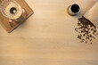 © kjekol - Overhead view of coffee beans with cup and filtration containers on table