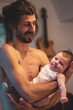 © Alexander - young father is happy about holding his newborn baby