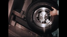 Mounting The Tire 1967 - A Technician Demonstrates The Dismounting And Moutning Of A Tire On A Machine Designed For Testing, In 1967.