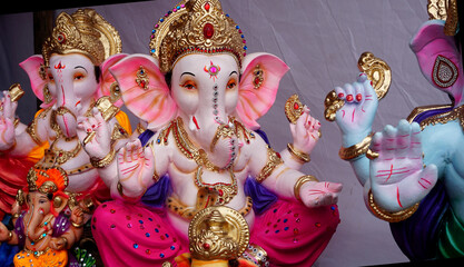 indian hindu god lord ganesha statues, coated with colors and sold for ganesh chathurthi