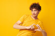 © Tatiana - guy with red curly hair wearing stylish yellow t-shirt posing isolated background unaltered