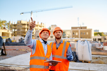 Worker reporting to contractor at construction site