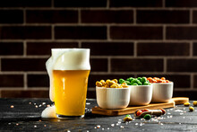 Bowl Of Nuts And Beer On Wooden Table, Set Of Peanuts With Different Flavors, Snacks For Beer. Banner, Menu, Recipe