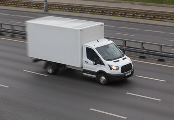 Wall Mural - truck moves on a multi-lane highway