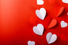 Valentine's Day. Red And White Hearts On A Red Background. Copy Space. Holidays And Love Concept.