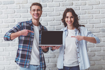 Canvas Print - Young couple in the studio