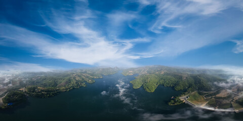 Wall Mural - panorama landscape amazing view Mae Suai Dam or reservoir in a valley and blue sky at chiang rai Thailand, aerial view from drone for background