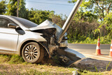 Fototapeta  - The white sedan was involved in a collision with an electric pole.