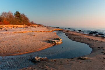 Canvas Print - Baltic Sea rocks and beach sand at sunset