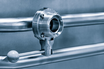 Poster - Pipelines from stainless steel, a system for pumping liquids or milk for the food industry. Abstract industrial background.