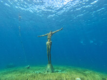 Underwater Statue Of Jesus Christ Off The Coast Of Cozumel, Mexico In Quintana Roo. The Religious Statue Is A Popular Sight For Scuba Divers And Tourist Snorkelers On Vacation.