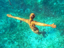 Underwater Statue Of Jesus Christ Off The Coast Of Cozumel, Mexico In Quintana Roo. The Religious Statue Is A Popular Sight For Scuba Divers And Tourist Snorkelers On Vacation.
