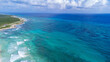 © Mat Hayward - Aerial view captured by drone of beautiful turquoise blue ocean water in the Caribbean sea clear with a view of the coral reef surrounding tropical island Cozumel, Mexico in Quintana Roo.