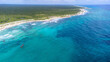 © Mat Hayward - Lush jungle and beautiful turquoise Caribbean ocean water on the beach of Cozumel captured by a drone flying over Quintana Roo, Mexico.