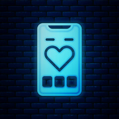 Poster - Glowing neon Smartphone with heart rate monitor function icon isolated on brick wall background. Vector