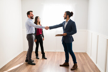 Wall Mural - Side view of clients meeting a real estate agent