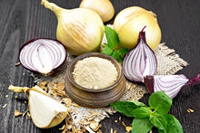 Onion Powder In Bowl On Wooden Board