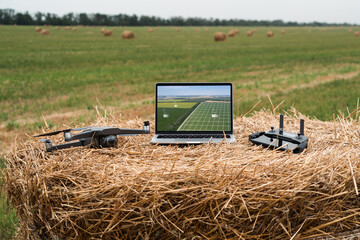 Sticker - Laptop and drone on the field. Smart farming and agriculture digitalization