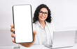 © Prostock-studio - Female doctor showing big smartphone with blank screen, sitting in office at workplace, closeup, mockup