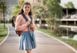 © chachamp - Student girl with bag at school park