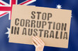 © AndriiKoval - The phrase ' Stop Corruption in Australia ' on a banner in men's hand with blurred Australian flag on the background. Forbidden. Prevent. Wealth. Offence. Corruptness. Economy. Corruptible