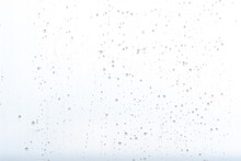 Sky Background With Water Drops On A Glass Window