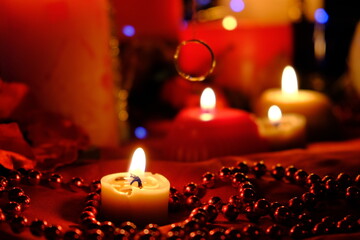 fortune-telling on fire and a ring, russian divination for love at christmas. burning red candles, h