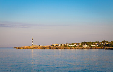 Wall Mural - Scenic Artrutx Lighthouse at sunset in Minorca, Spain