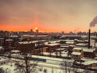 Wall Mural - View from a frosty window on a snow-covered city in winter