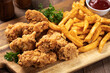 © chas53 - Crispy fried chicken tenders and french fries