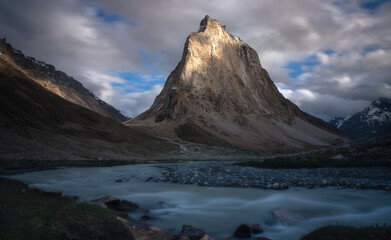 Play of lights and shadows on gumbo Rangjan Peak in Zanskar region of Ladakh, India