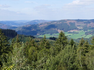 View from the circular path of the Glinge pumped hydroelectric energy storage, North Rhine-Westphalia, Germany, of the mountains and forests of the Sauerland Blick vom Rundweg des Speicherwerks Glinge