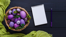 Easter Eggs, Purple And Lilac , On A Gray Wooden Table, With A Notepad For Writing, Mockup,Easter Card, Banner, Selective Focus, Horizontal