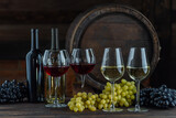 Fototapeta Panele - Wine glasses with tall stem. Old oak barrel in a dark wine cellar at the winery. Aging cellaring wine tasting