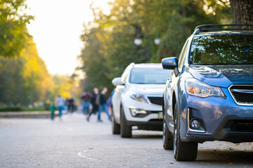 Canvas Print - Cars parked in a row on a city street side