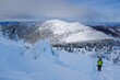 © Iwona - Beautiful view of Mala Babia Gora in sunny winter scenery. Babiogorski National Park, Beskid Zywiecki, Poland. Silhouette of person on trail.
