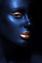 Fashion Portrait Of A Blue-skinned Girl With Color Make-up. Beauty Face.
