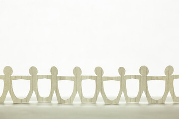 Wall Mural - Paper human chain on clear white background, teamwork, people join together, and friendship concept