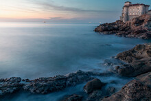 Boccale Castle Landmark On Cliff Rock And Sea On Warm Sunset.