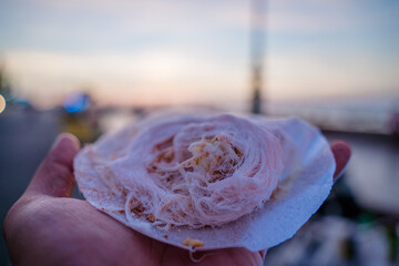 Close up Sweet thread candy street food make with milk and coconut and peanuts. It's 